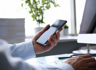 Businessman hipster holds telephone background